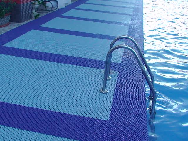 Poolside mat installation around wet area